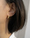 simple sophisticated korean style gold hoop earrings with a short bob hairdo