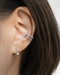simple timeless ear stack style with the hexad pixie huggie hoop and astraea ear cuff in silver
