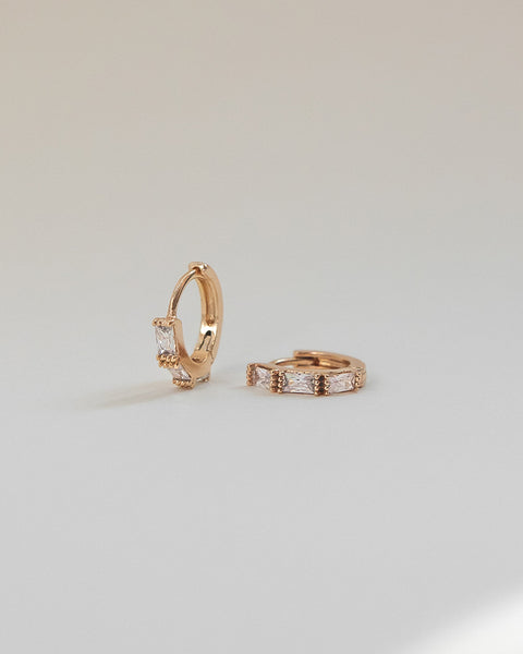 sleek small huggie earrings with baguette cut diamonds @thehexad