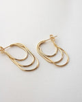slither drop earrings features three slinky hoops in one