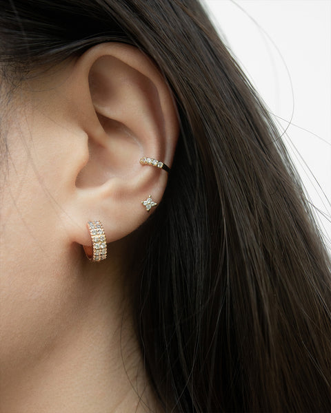 soiree huggie hoop styled with the moonshine ear cuff for a stylish glittery ear stack