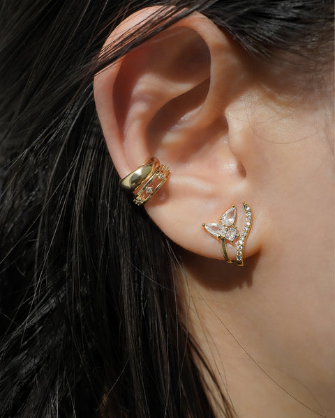 stunning ear stack combo featuring corsage illusion earring, iconic cosmic and cult ear cuffs by the hexad