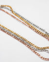 the hexad ellipses chain necklaces in gold silver and rose gold layered together