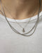 the hexad teardrop necklace layered with reptile chain and cuba chain in silver