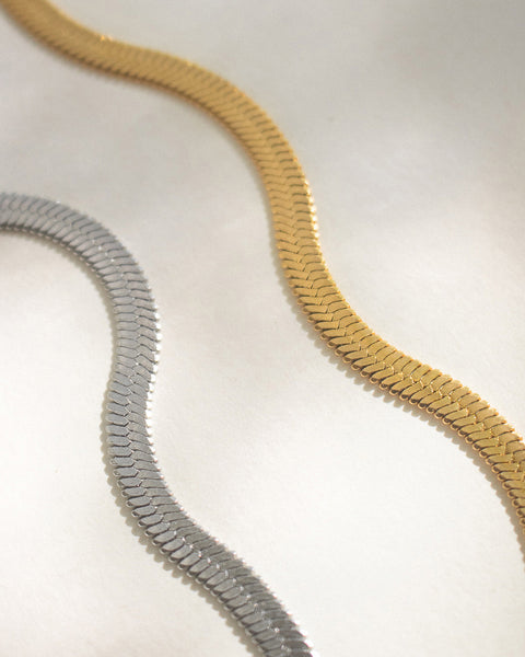 thick and flat Cobra chain necklaces designed by the hexad in silver and gold