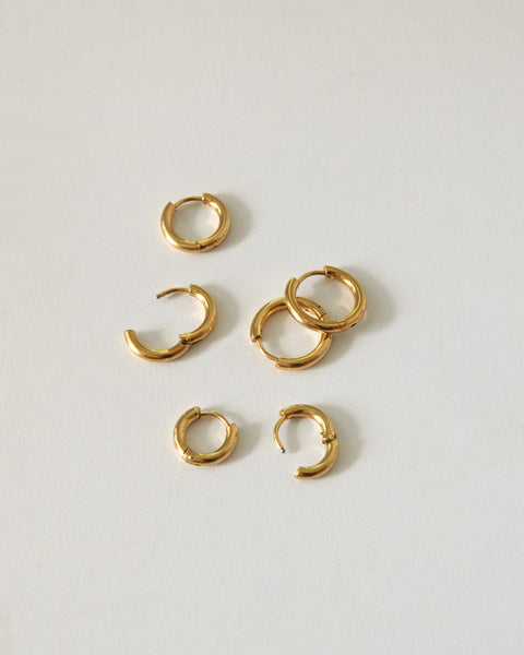 uki huggie hoops in gold by the hexad