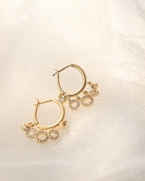 whimsical bohemian circle charms hoop earrings in sparkly gold