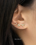 whimsical ear stack featuring cute honeycomb and bee studs from the garden of eden set of 9 gold earrings